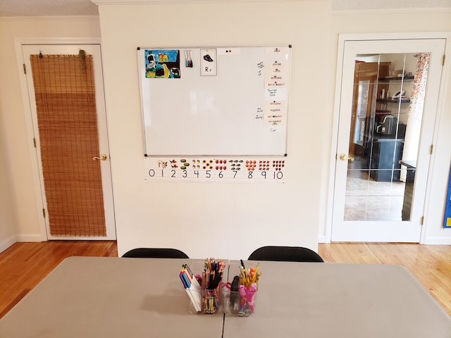 Homeschool classroom table, whiteboard, supplies caddy